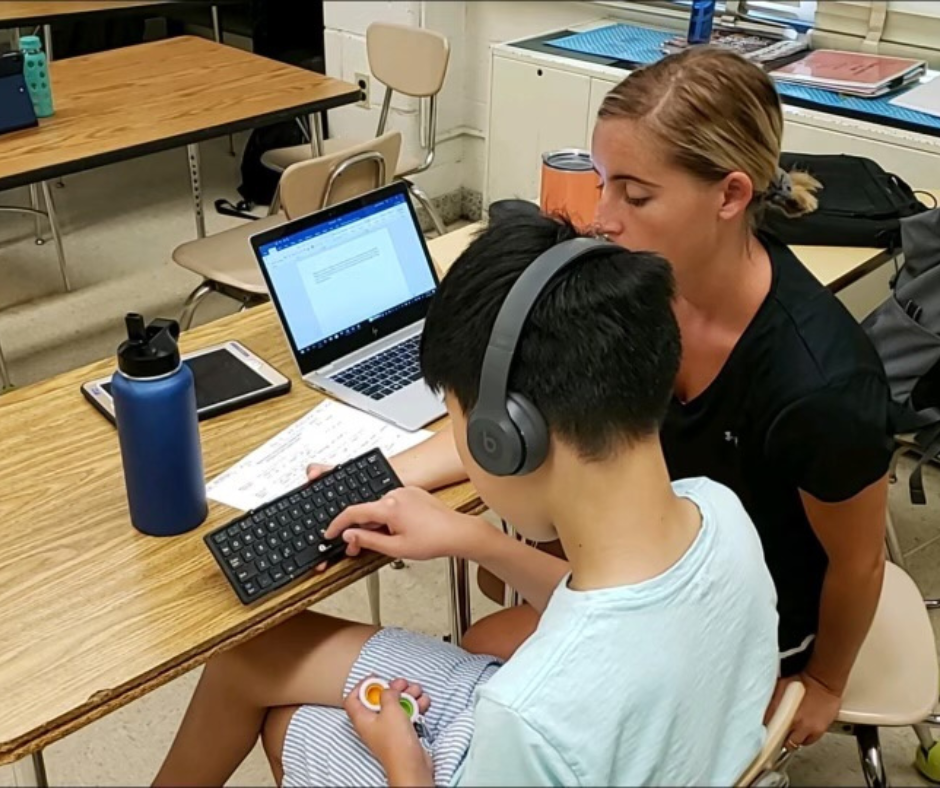 Educator working with non-speaking learner